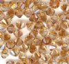 25 4mm Crystal Copper Bicone Swarovski